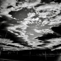 a black and white photo of a cloudy sky