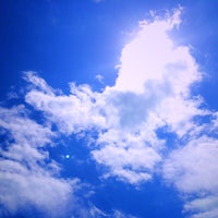 a kite flying in the blue sky